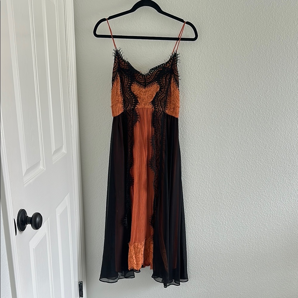 Anthropologie. Elegant Black and Orange Lace Dress. Sold at Anthropologie